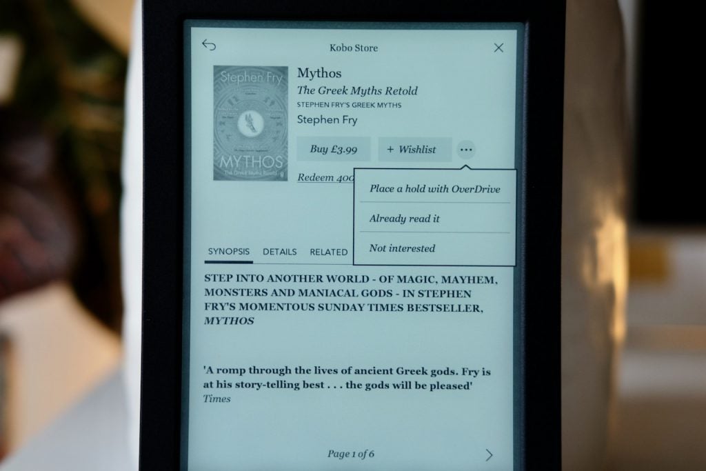 A black Kobo e-reader displaying Mythos book on Kobo store