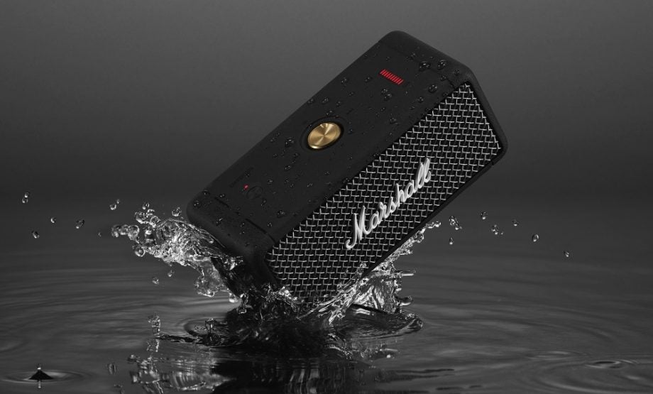 Picture of a black Marshall Emberton speaker falling into water