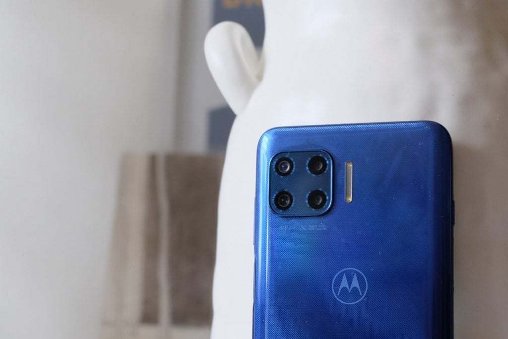 Close up image of a blue Motorola G 5G Plus's top hald back panel