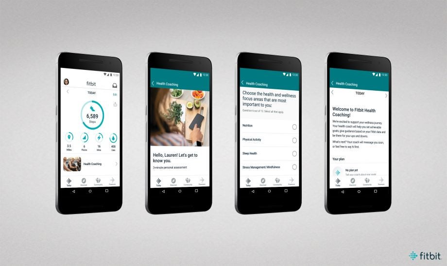 Smartphones displaying features from Fitbit premium application