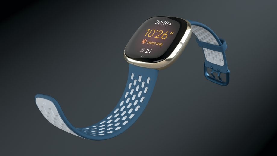 A blue Fitbit Sense 3 watch floating on a dark background