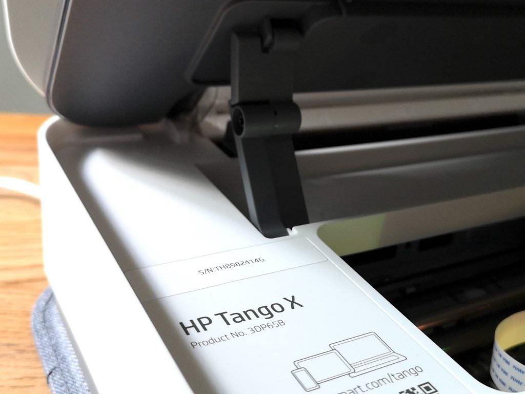 Close up image of opening panel of a white HP Tango X printer