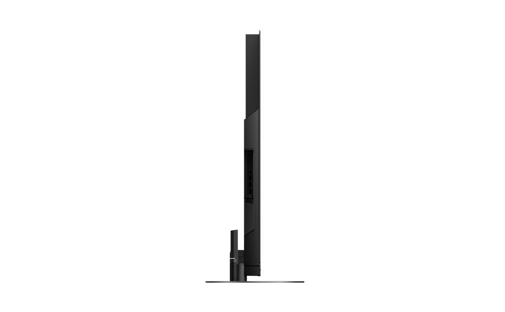 Left side edge view of a black Panasonic TX HZ1500 TV standing on white background