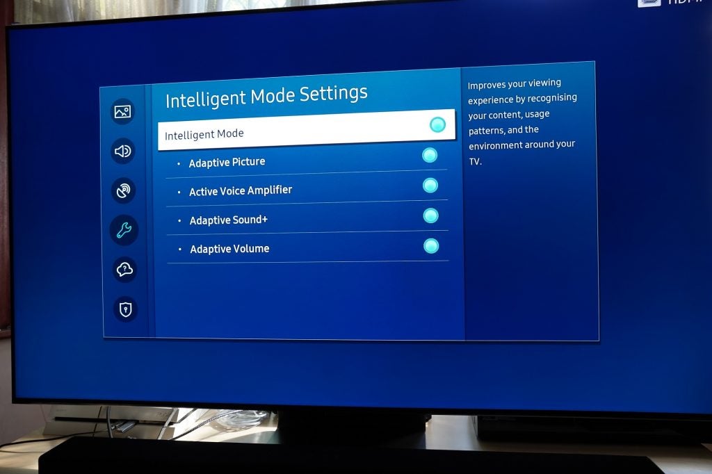 A black Samsung Q95T TV displaying Intelligent mode settings menu