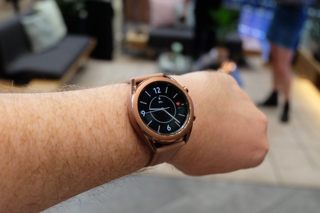 A brownish-pink Galaxy watch 3 tied on wrist