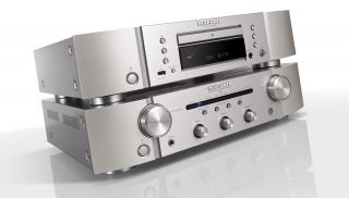 A silver Marantz CD6007 player standing on a silver Marantz PM6007 on a white background