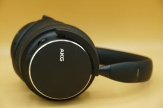 Close up image of black AKG Y600NC headphone's earpad