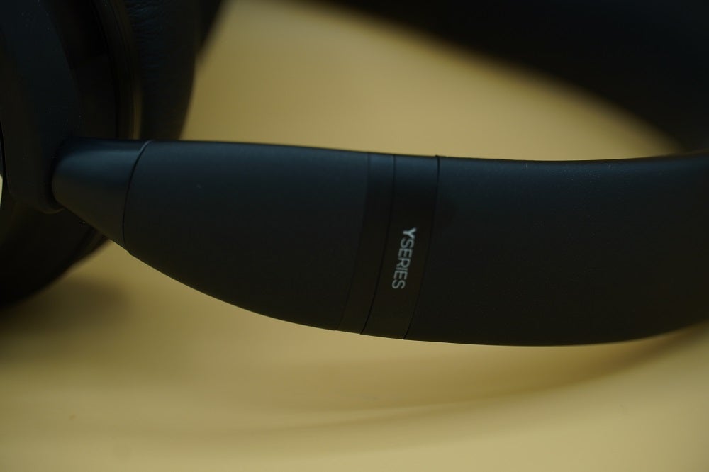 Close up image of black AKG Y600NC headphone's headband