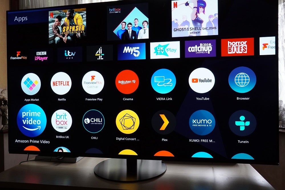 A black Panasonic HZ1000 standing on a table, displaying applications on My Home Screen