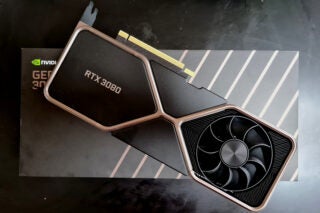 A black pink GeForce RTX 3080 resting on its box