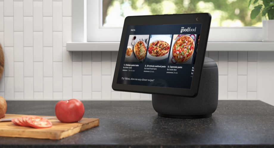 A black Amazon Echo show 10 standing on a kitchen platform displaying content from GoodFood