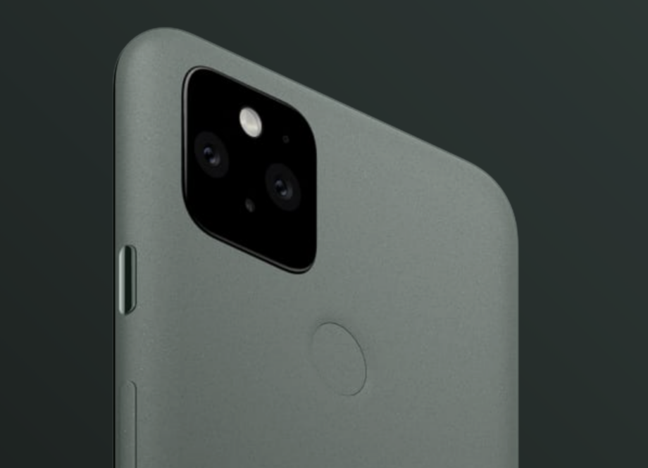 Top half back panel view of Google Pixel 5 standing on a black background