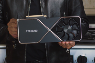 A black GeForce RTX 3090 held in hand
