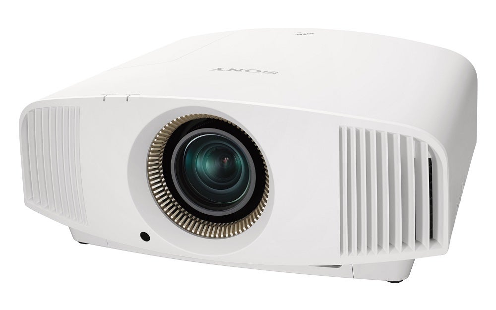 Right angled view of a  white Sony VPL VW590ES standing on a white background