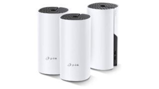 Three white cylinder shape devices standing on white background with TP Link printed on them