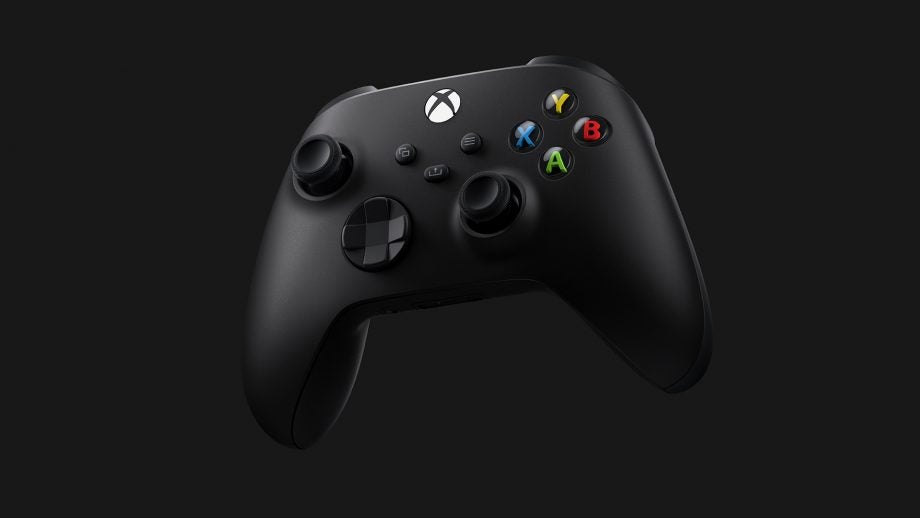 A black Xbox controller floating on a black background