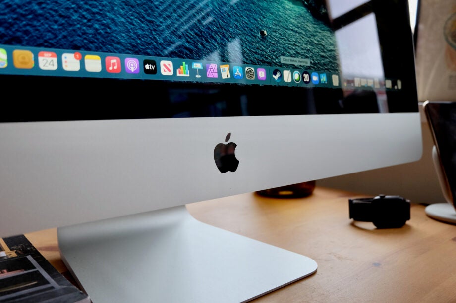 Close up image of Apple logo on a white iMac