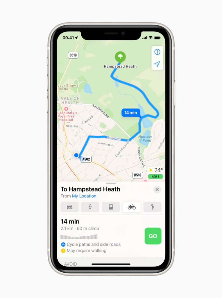A black iPhone standing on a white background displaying navigation to Hampstead heath on Apple maps