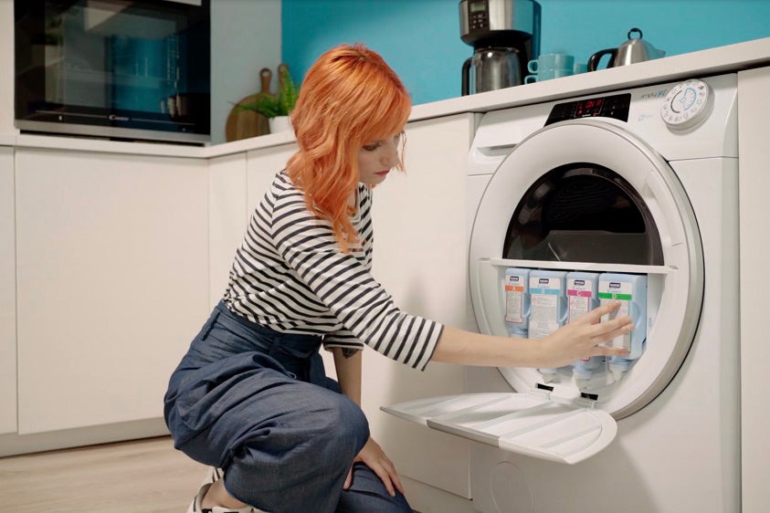 A women using Candy washpass appliance