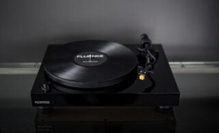A black Fluance RT80 standing on a black background