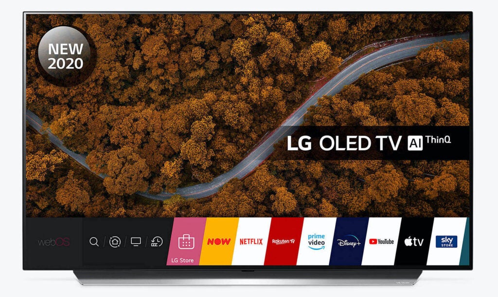LG 48 CX OLEDA black LG OLED 48 CX TV standing on a white background displaying webOS homescreen