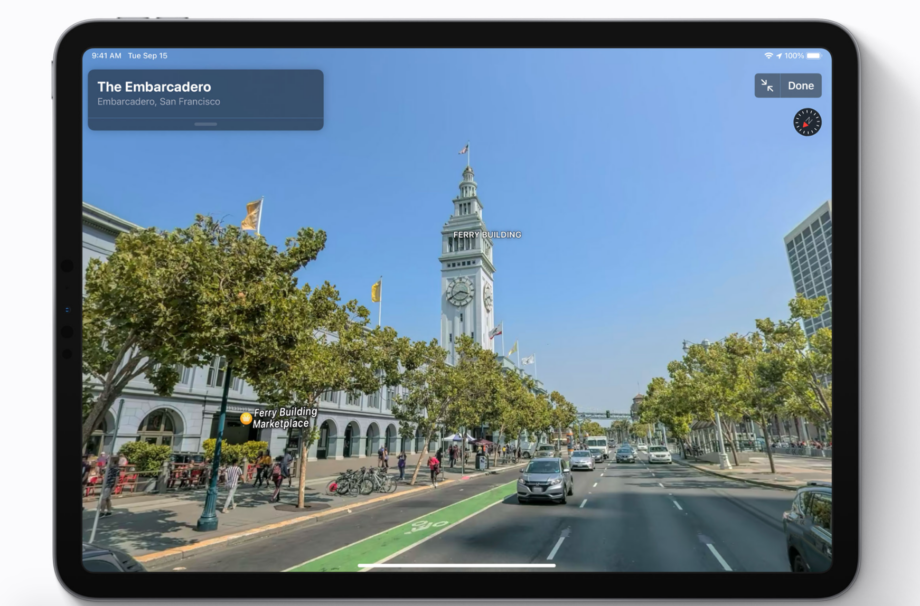 A black iPad standing on a white background displaying street view of a place Apple maps