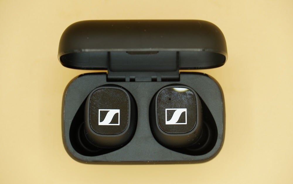 View from top of black Sennheiser CX 400T earbuds resting in it's black case