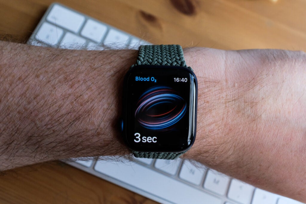 Apple Watch 6A smart watch tied to a wrist displaying blood oxygen