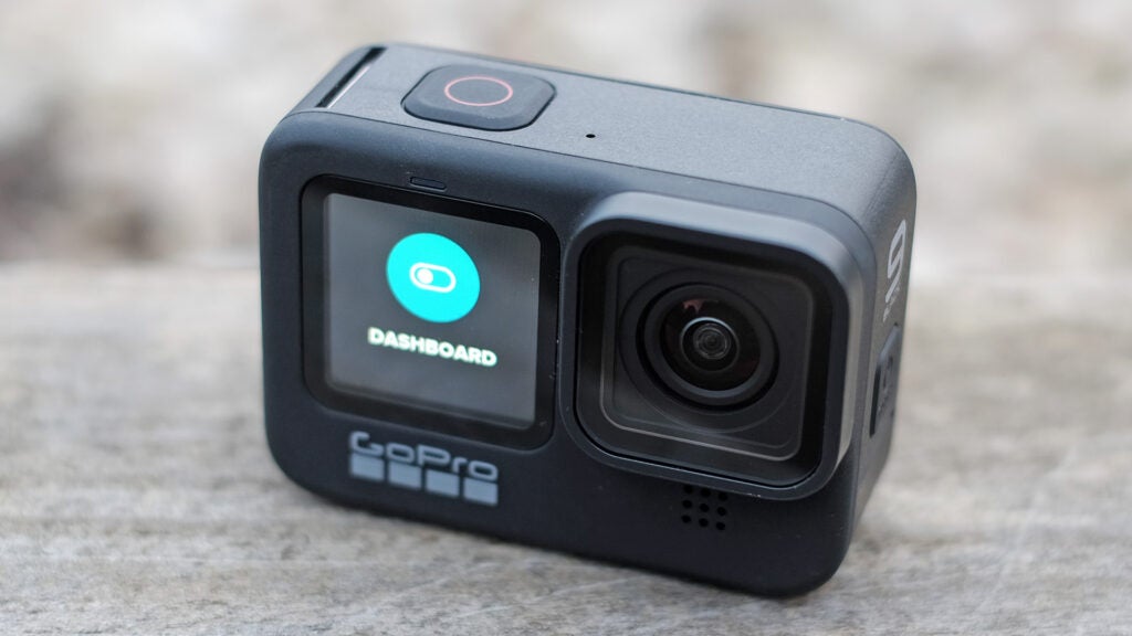 Close up image of a black GoPro dash cam standing on floor