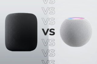 Comparision image of a black Homepod standing on the left and a white Homepod mini standing on the right