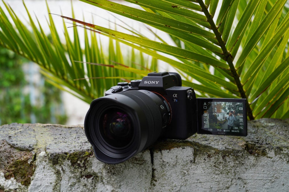 Right angled view of a black Sony A7S iii camera standing on a wall