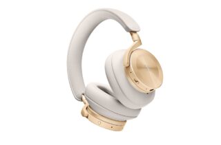 White and golden BO H95 headphones floating on a white background