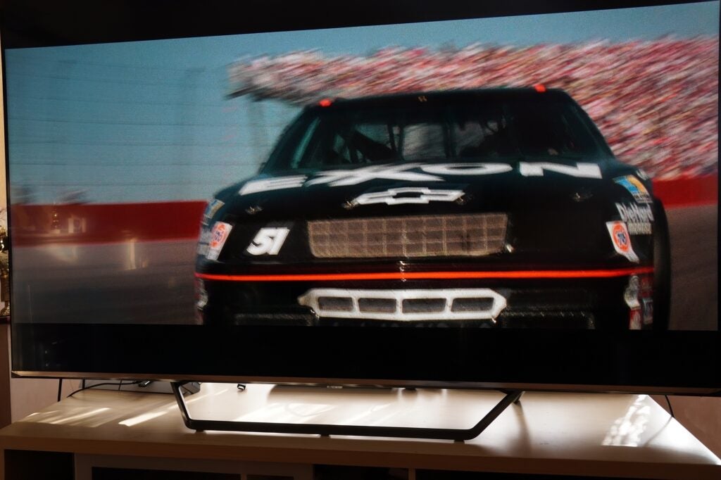 motor race game displayed  on wide screen gaming monitor