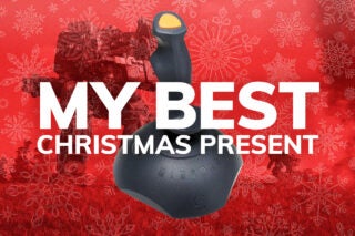 A joystick standing in red background with My best christmas present written on top