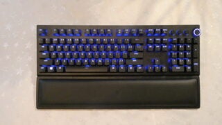 View from top, of a black BlackWidow V3 Pro keyboard with blue light beneath the keys