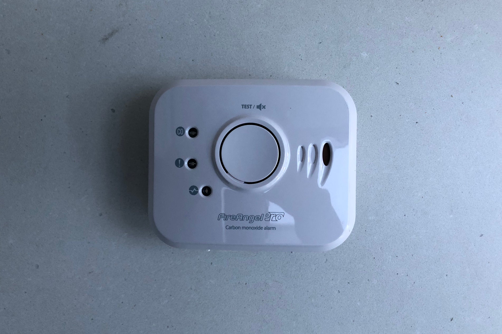 A white FireAngel Pro Connected CO Alarm attached to a white wall