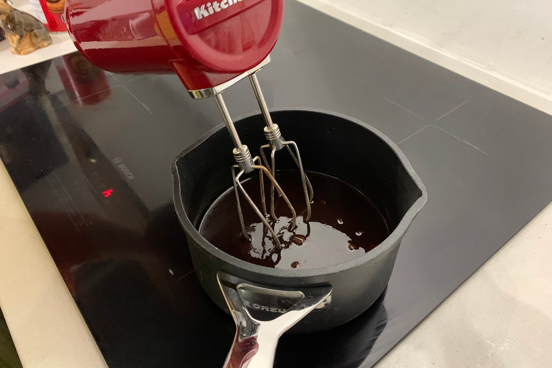 KitchenAid Cordless 7 Speed Hand Mixer mixing chocolate
