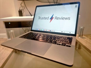 MacBook Pro front shot with Trusted Reviews wallpaper