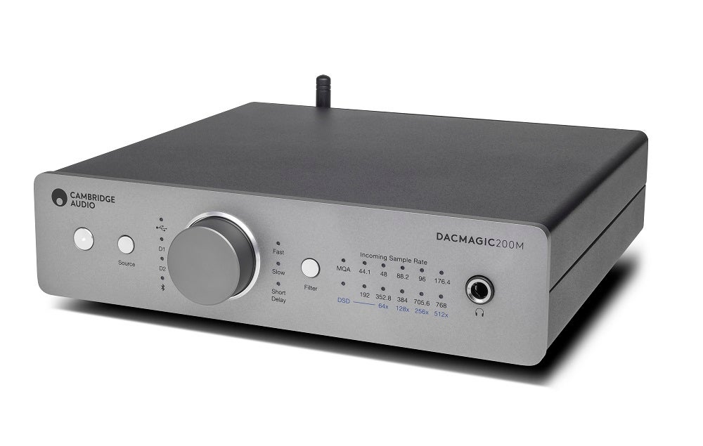A gray-silver Cambridge Audio's DacMagic 200M standing on white background