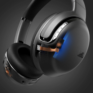Black and silver JBL Tour One headphones on black background showing Xray of built in mic