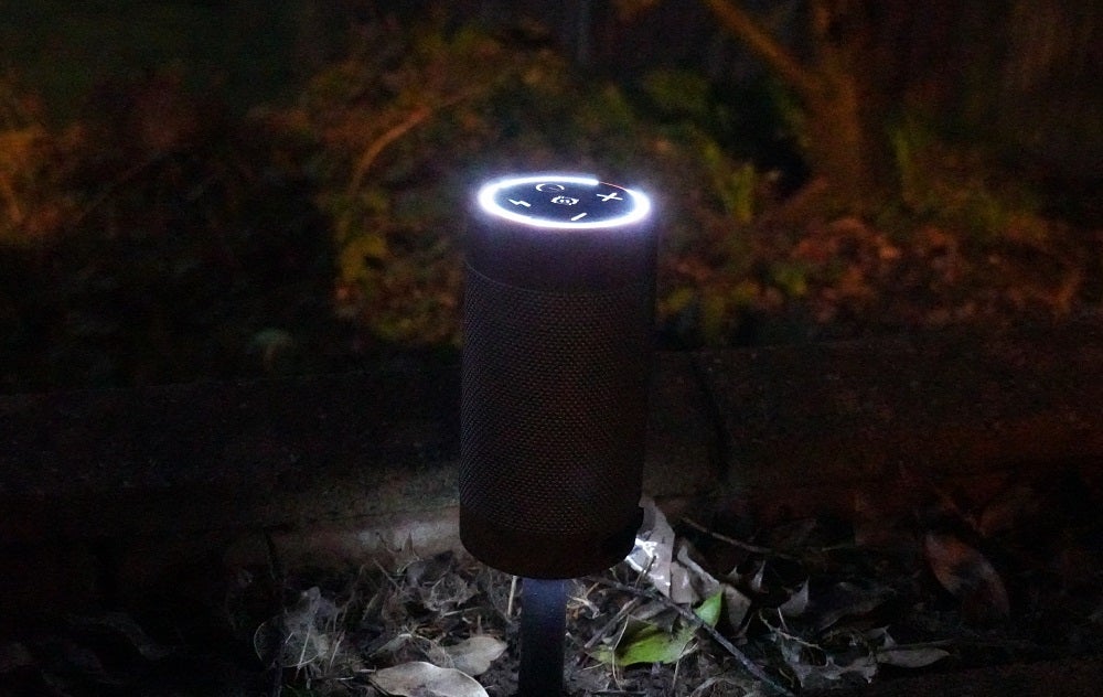 KitSound Diggit 55 at nightA black Kitsound diggit 55 speaker with light on top standing at an outdoor place at night