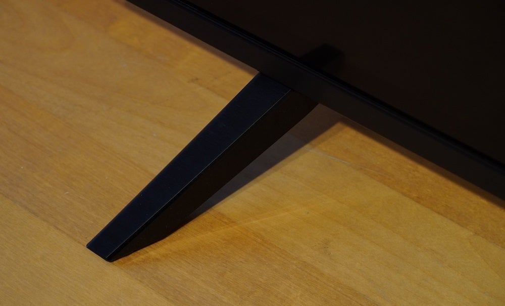 A black LG50UN70006LA TV's stand feet