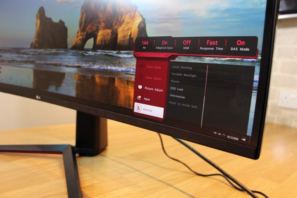 Bottom right corner view of a black LG UltraGear 38GN950 monitor, displaying monitor's settings menu