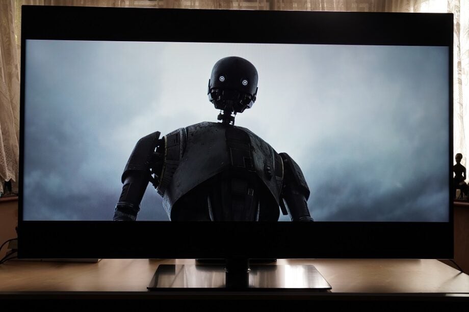A black Panasonic HX600 TV standing on a table, displaying a scene from Rogue One