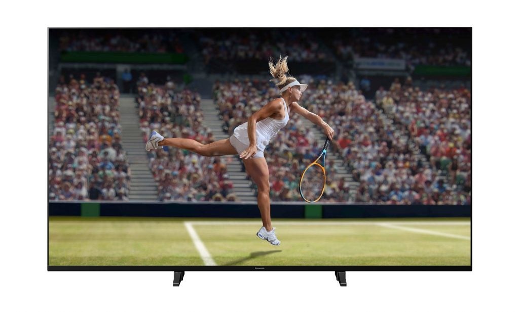 A black Panasonic JX940 TV standing on a white background displaying a scene from a Badminton match