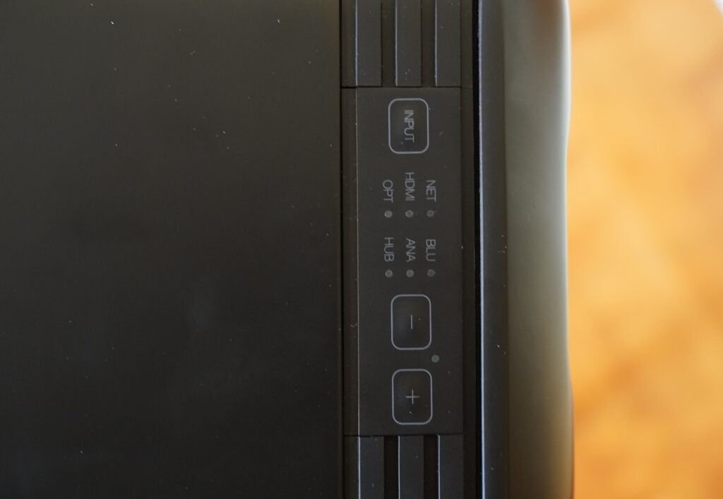 Close up image of a black Q-active 200 speaker's controls section