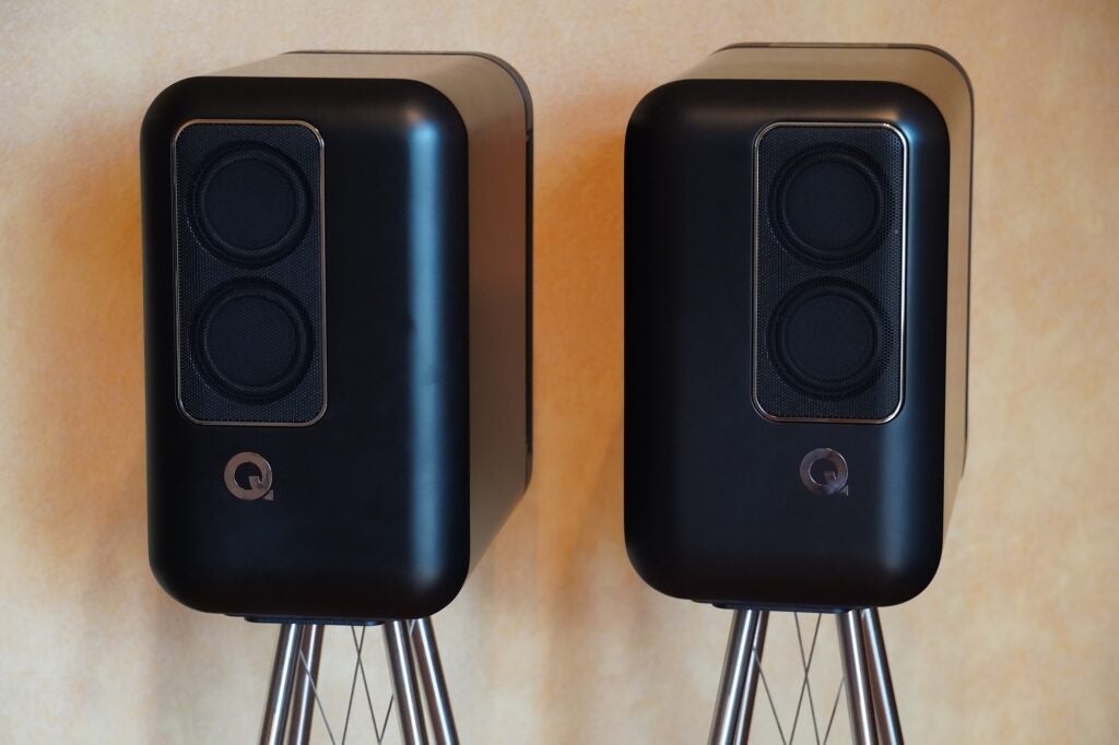 Q Active 200 pair on Q FS75 standsTwo black Q-active 200 speakers standing on their stands