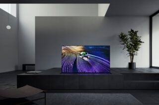 A black Sony TV 2021 standing on a black concrete surface