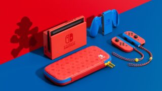 Red-blue Nintendo switch with other accessories resting on a blue-red background