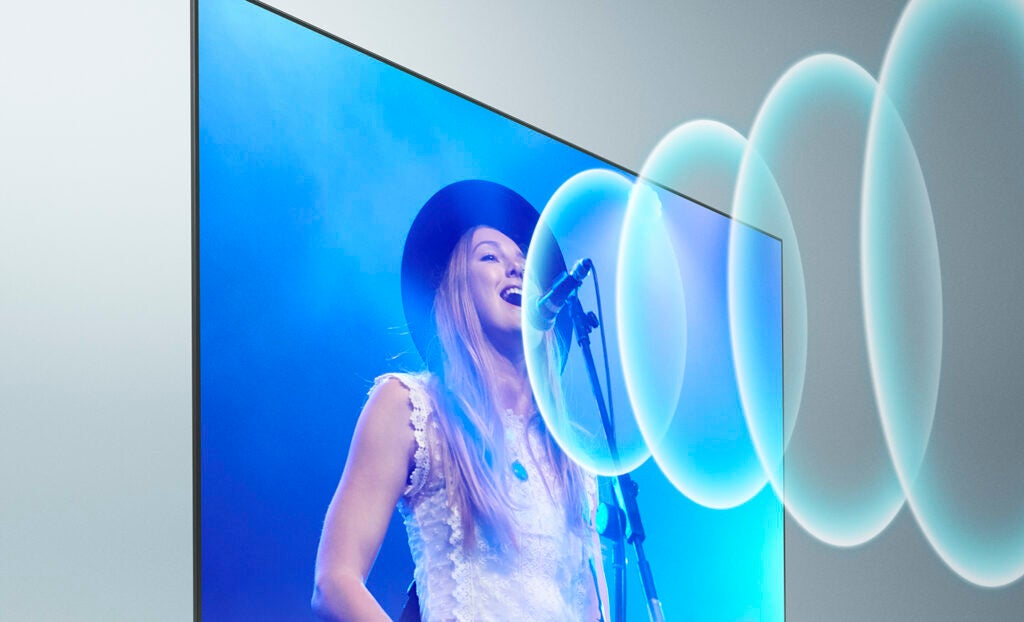 wide screen Tv with a nice blue background showing music video with a clear blue like wave sound system